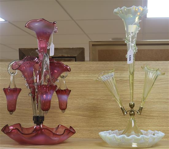 A Victorian cranberry glass epergne and a pale yellow vaseline glass epergne